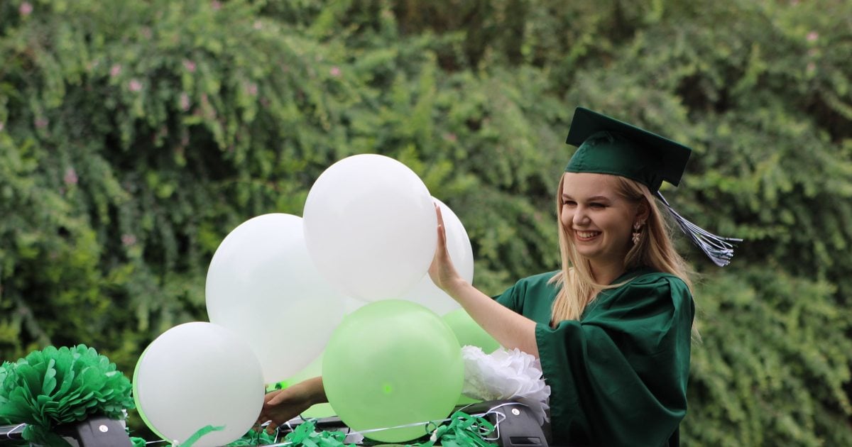 Woman Wearing Green Graduation Gown · Free Stock Photo